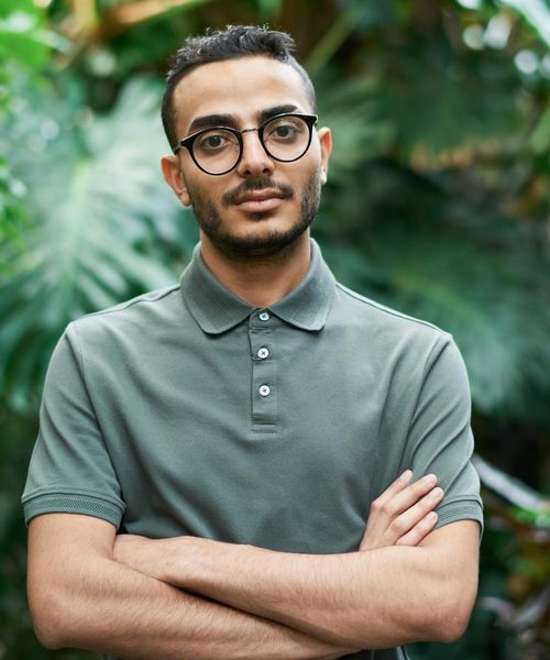 Confident man looking forward with a calm expression.
